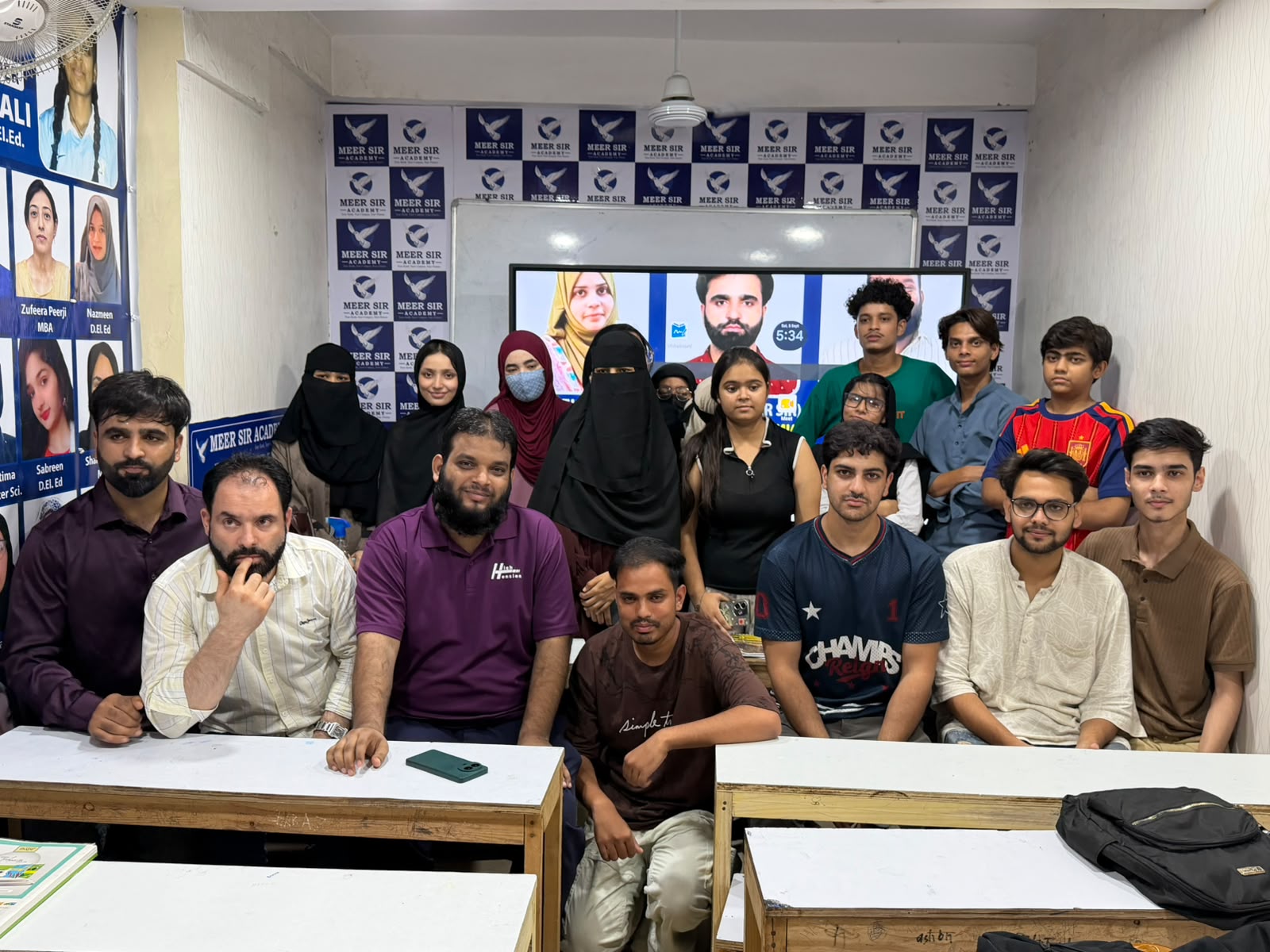 Students and educators in the Meer Sir Academy classroom