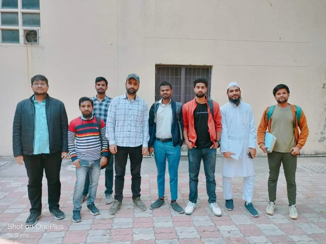Group of eight people standing outdoors